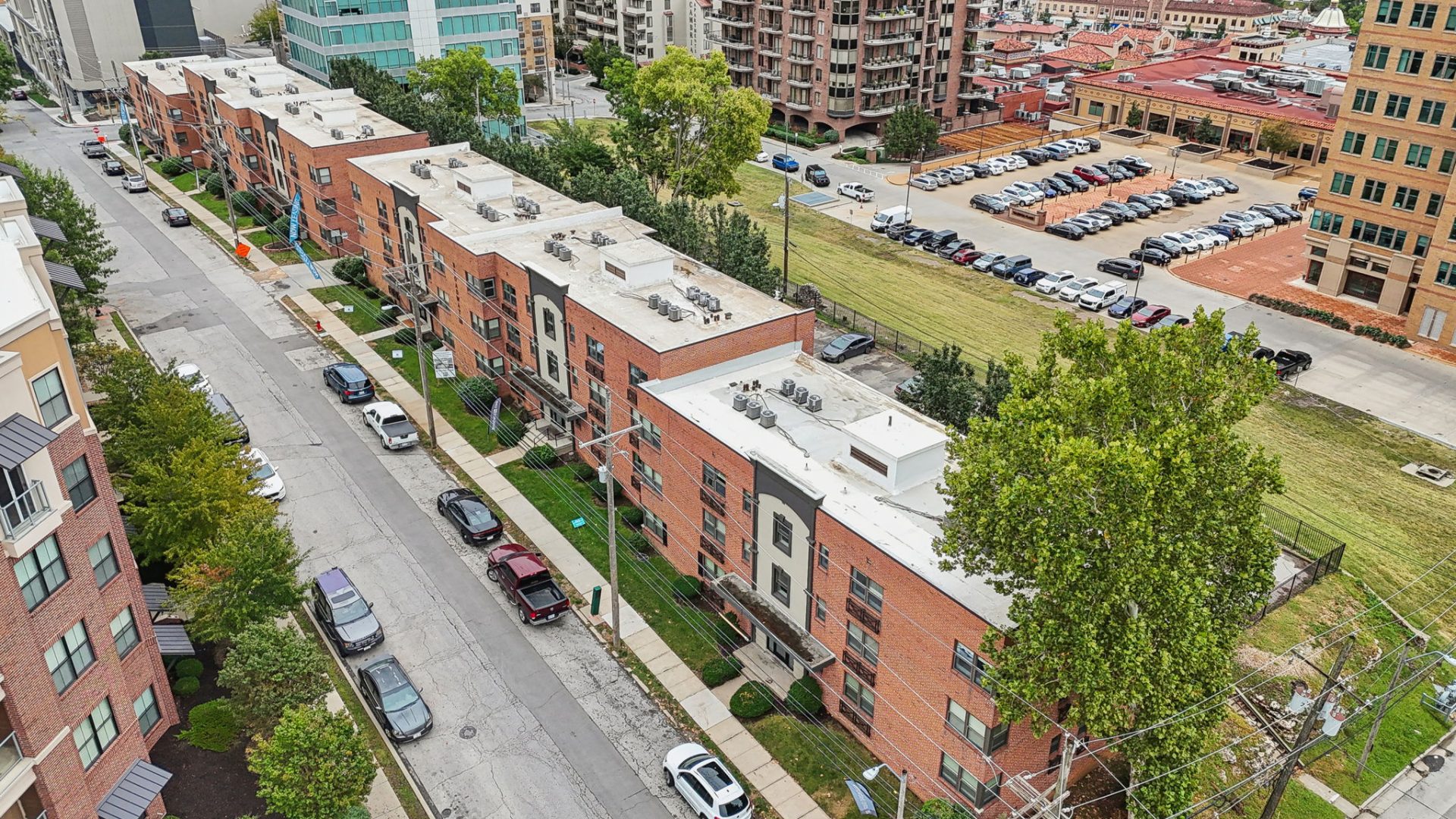 an aerial view of a city street with apartment buildings at The Broadway 46 Apartments